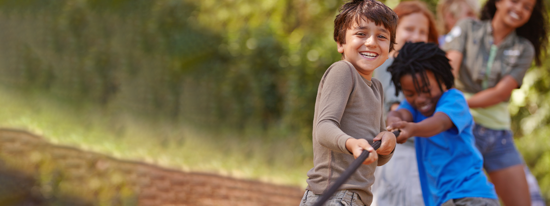 Happy Kids playing Tug-of-War