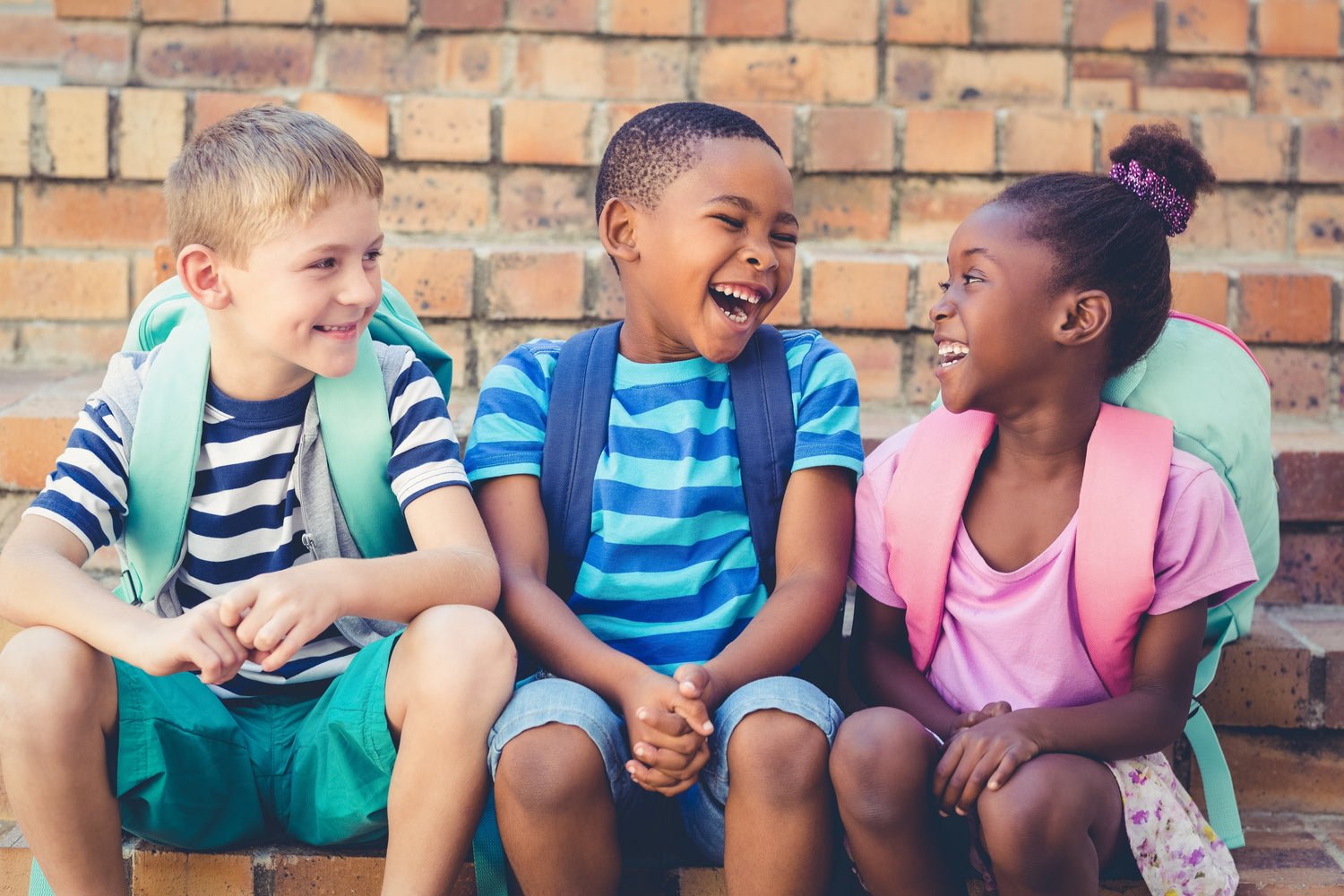 Three kids having a funny conversation 